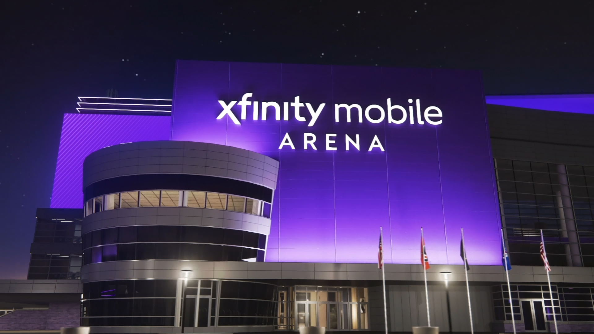 An artist's rendering of the Xfinity Mobile Arena signage over one of the building's entrances at night.